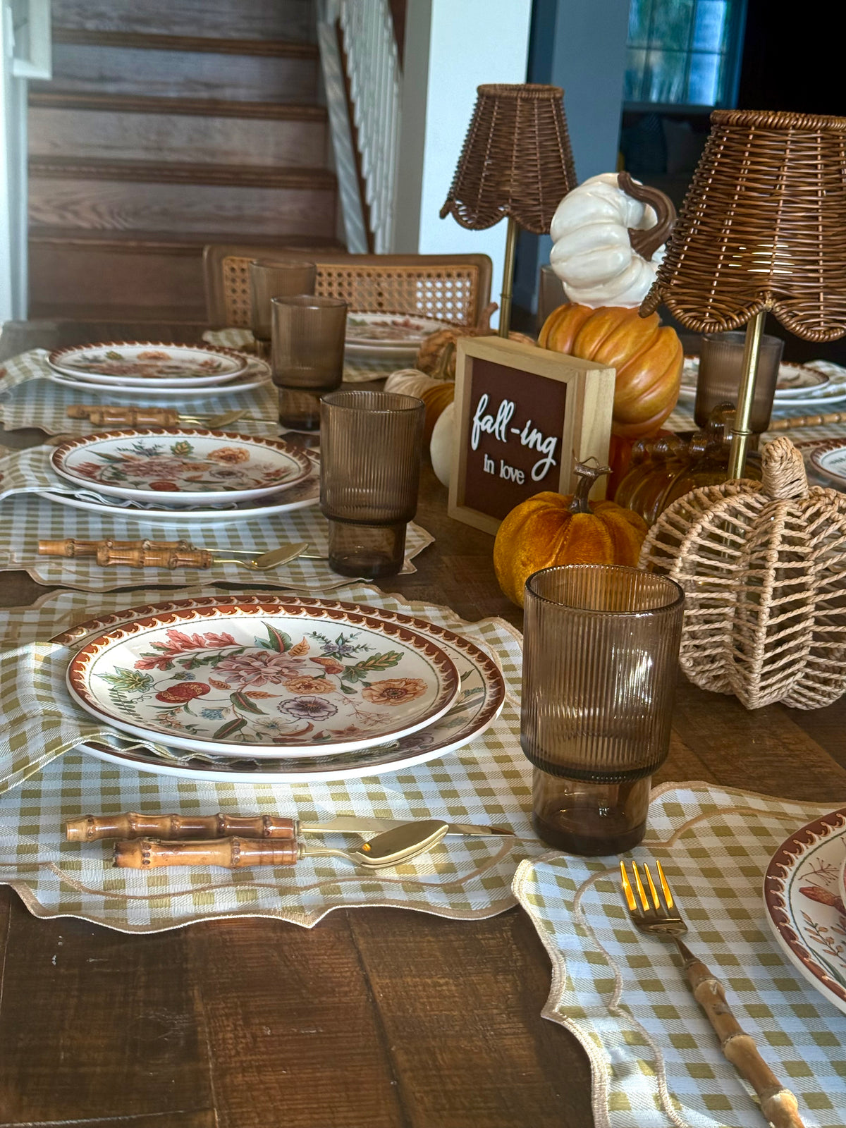 Reversible plaid and white placemat with an embroidered napkin