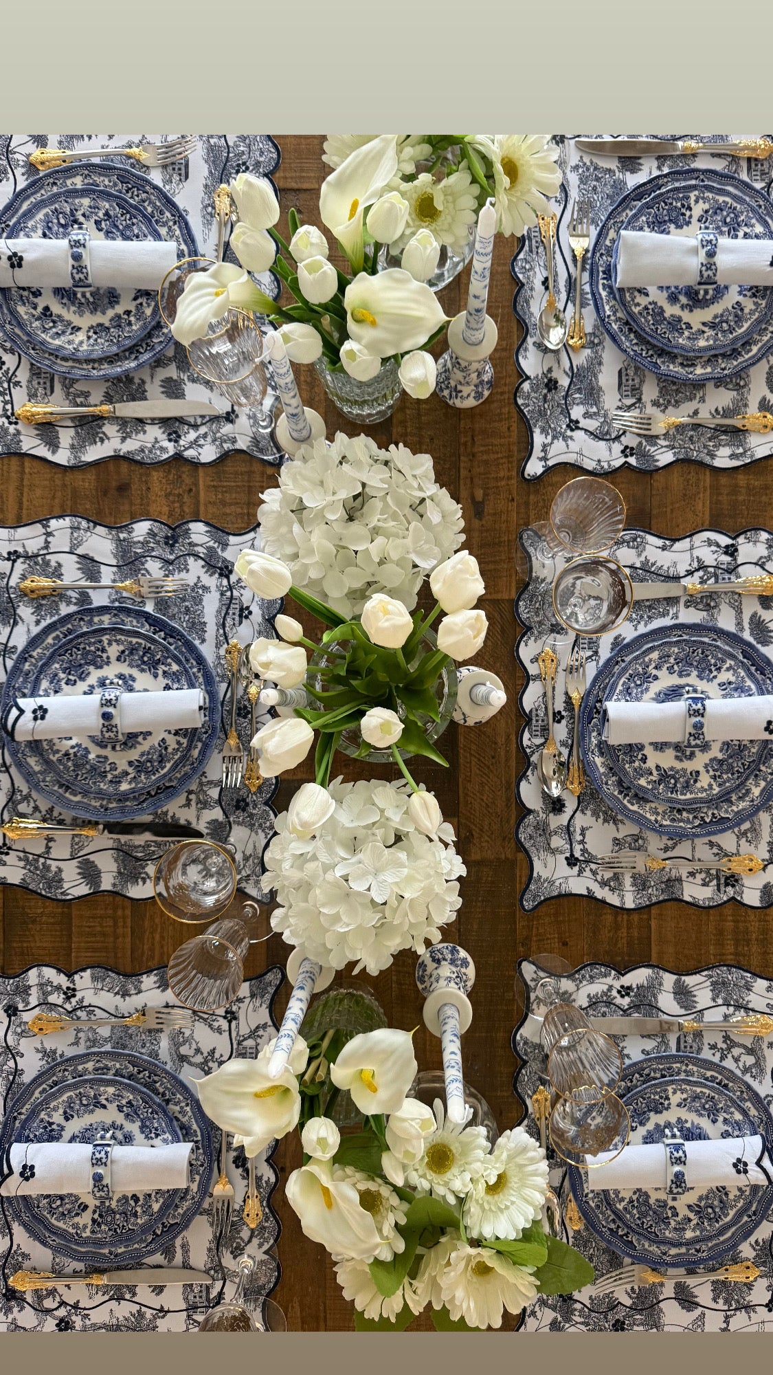 Reversible Toile de Jouy placemat with embroidered napkin.