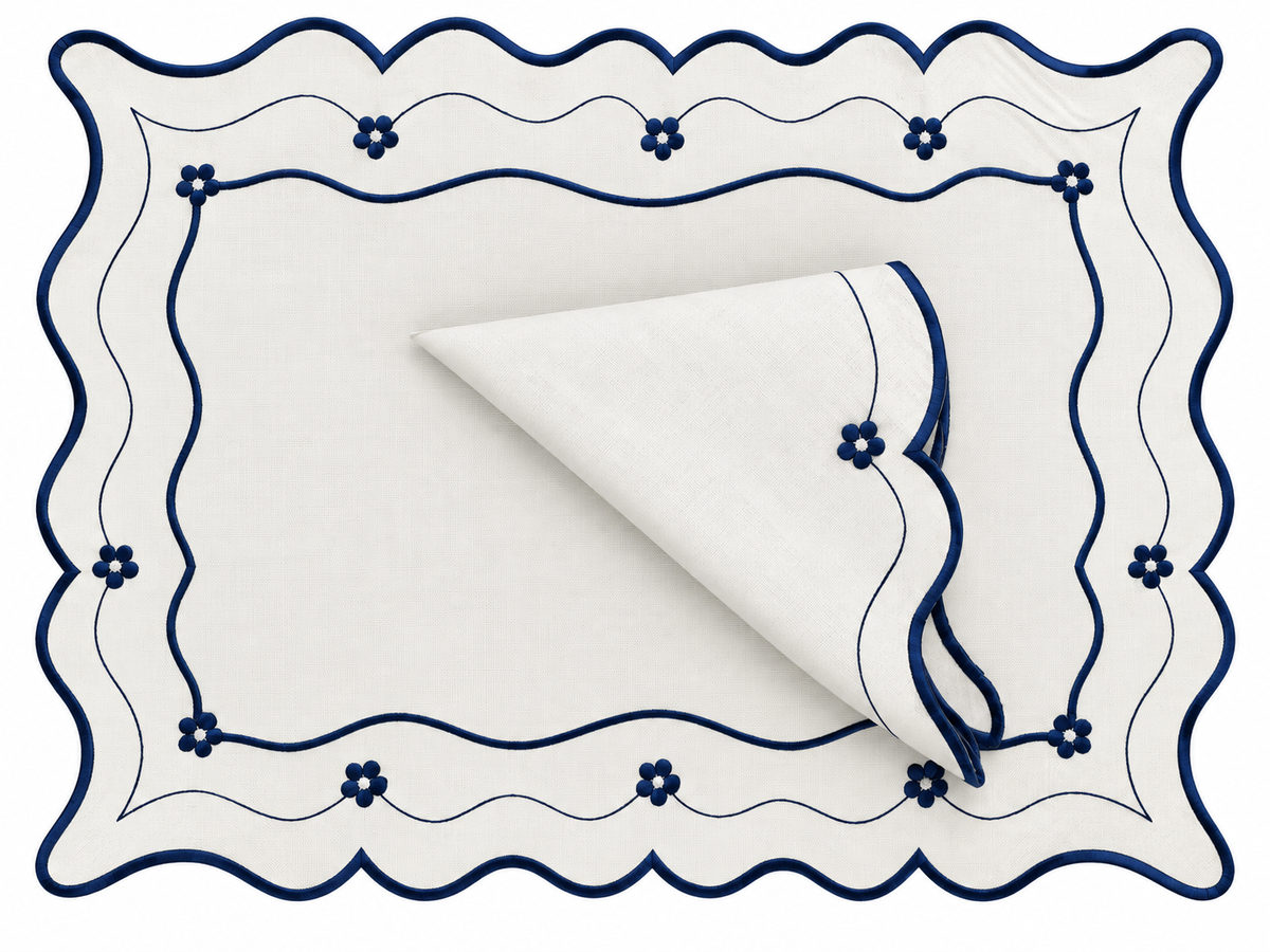 Reversible Toile de Jouy placemat with embroidered napkin.