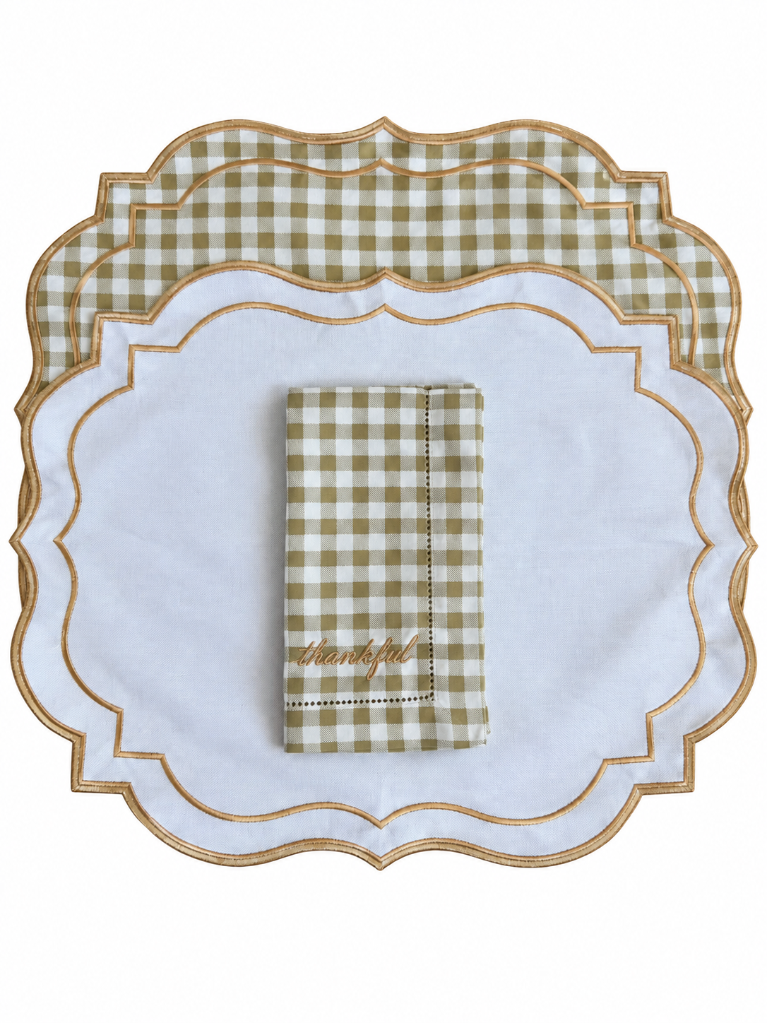 Reversible plaid and white placemat with an embroidered napkin