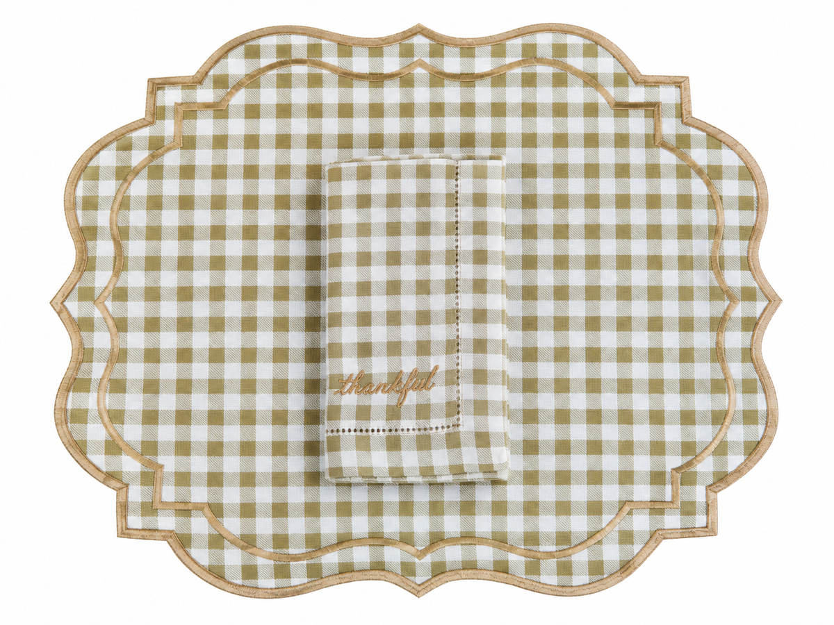 Reversible plaid and white placemat with an embroidered napkin