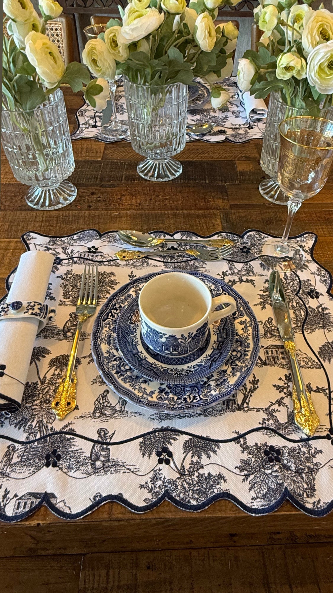 Reversible Toile de Jouy placemat with embroidered napkin.